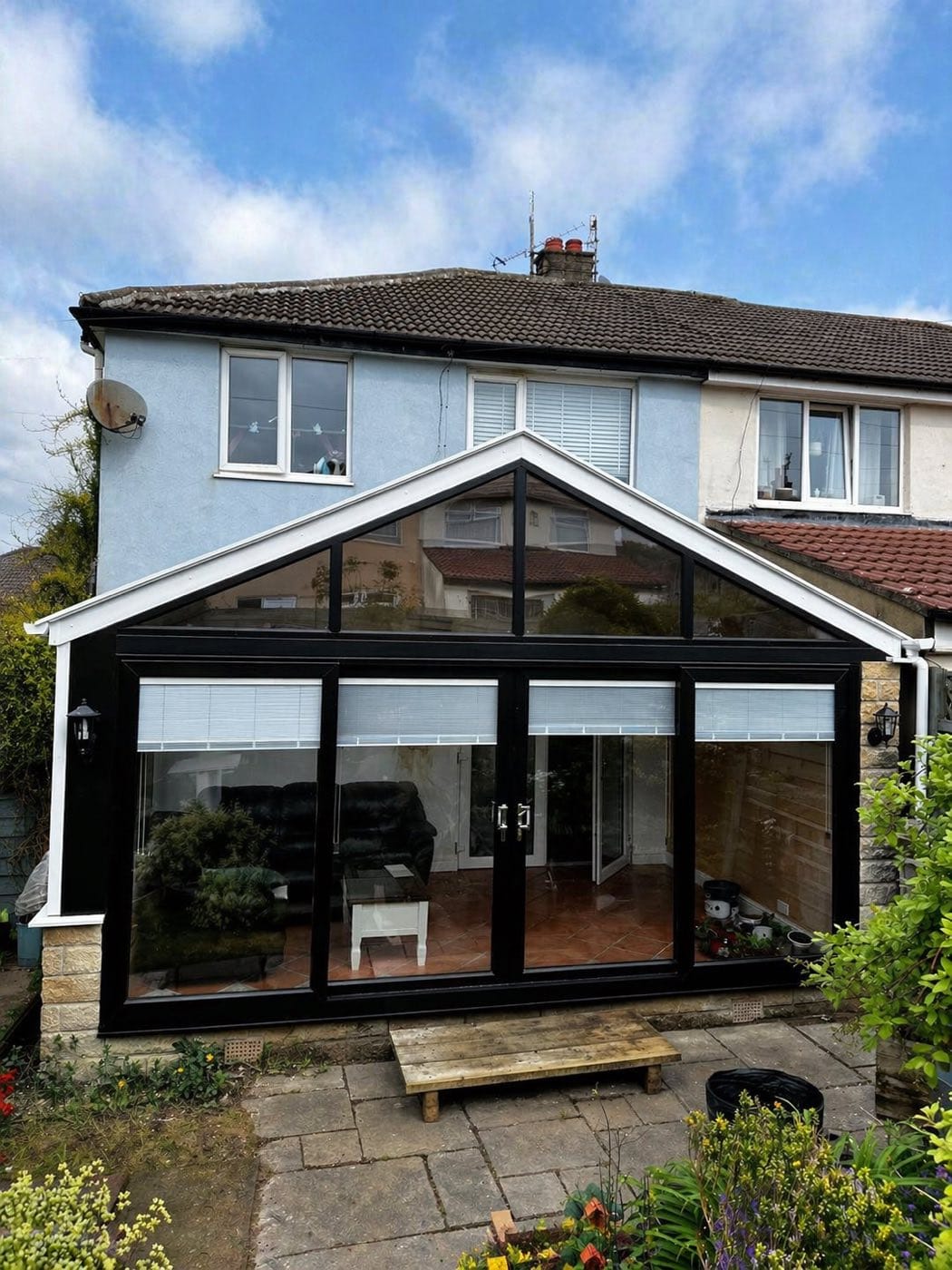 A conservatory fitted with an insulated tiled roof