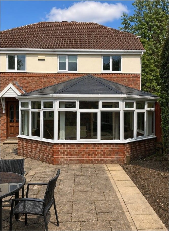 The same conservatory after a solid tiled warm roof was fitted to the existing frame